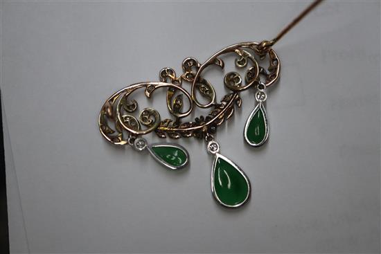 A 1920s yellow metal, diamond and jadeite set drop openwork scroll brooch, width 38mm.